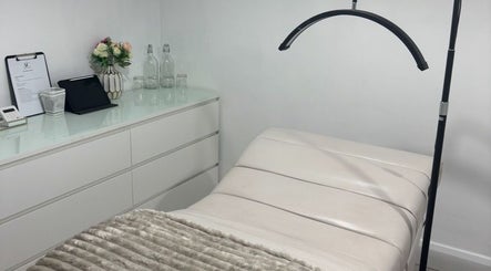 Cozy, modern beauty treatment room at The AC Studio, Naas, County Kildare, IE featuring a plush bed and sleek decor.