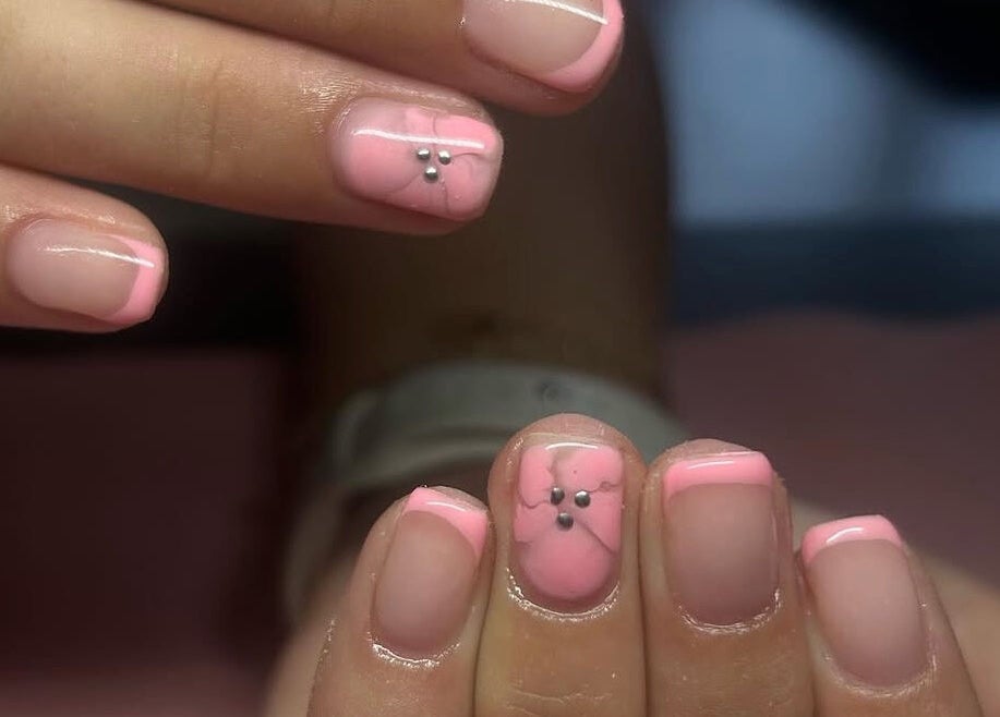 Pink manicure with delicate design at Nails By Mya, Blantyre, Scotland, GB.