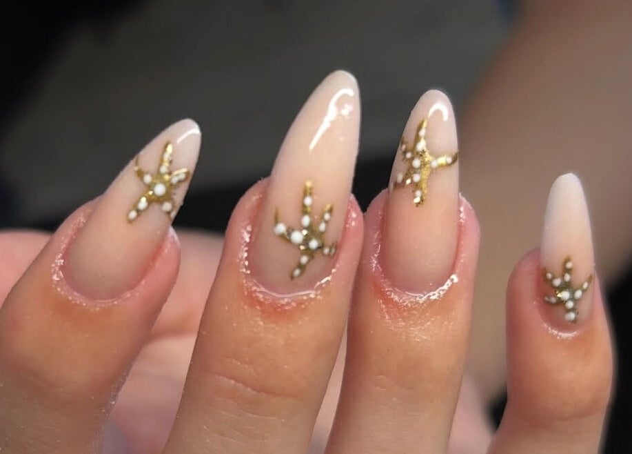 Elegant gold-studded nail art at Nails By Mya, Blantyre, Scotland, GB.
