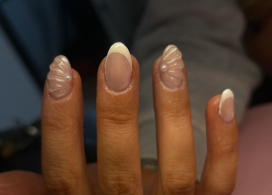 Intricate nail art at Nails By Mya, Blantyre, Scotland, GB showcases refined white designs.