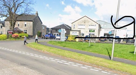 Street view of Rhi lly Braw Nails & Beauty at Linwood, Scotland, GB with surrounding greenery.