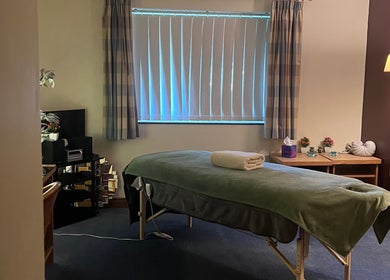 Relaxing therapy room at Pure Massage Therapy, Newton Abbot, England, GB with a cozy massage table.
