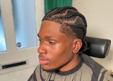 Intricate braided hairstyle at LMBlendz, Birmingham, England, GB highlighting expert styling.