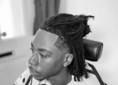 Close-up of a detailed haircut showcasing dreadlocks at LMBlendz, Birmingham, England, GB.
