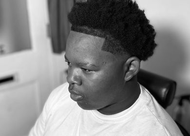 Stylish haircut at LMBlendz, Birmingham, England, GB showcasing precise edging and modern styling.