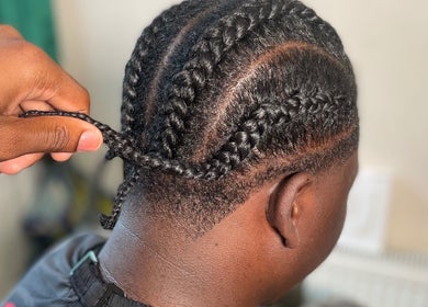 Intricate braiding at LMBlendz, Birmingham, England, GB, showcasing expert hairstyling techniques.