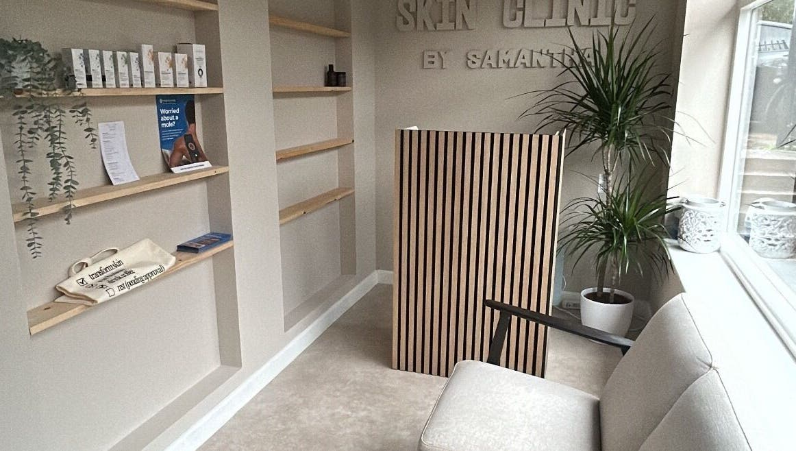 Reception area at Skin Clinic By Samantha in Lydney, England, GB featuring minimalist decor and cozy seating.