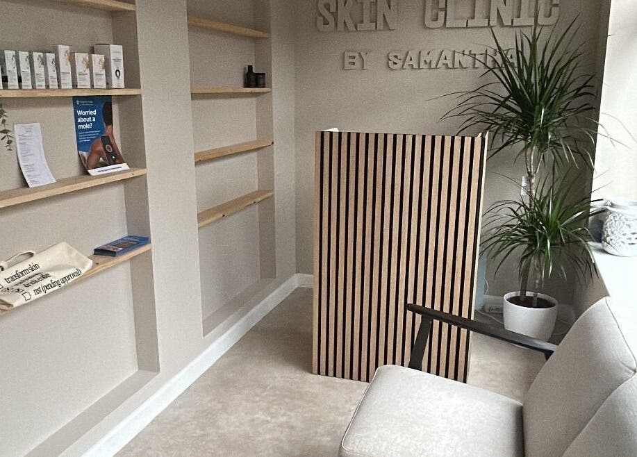 Reception area at Skin Clinic By Samantha in Lydney, England, GB featuring minimalist decor and cozy seating.