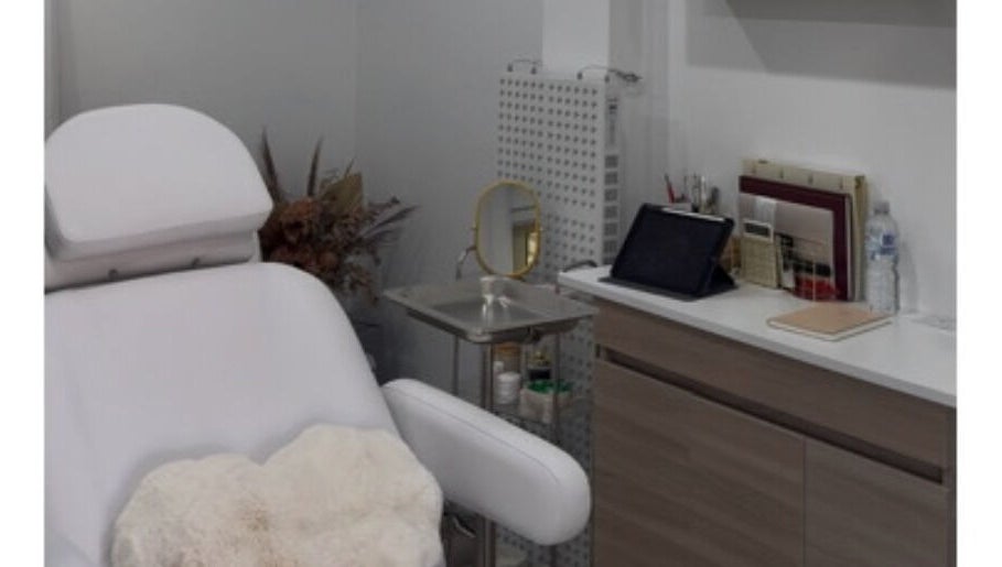 Elegant treatment room at Aesthetix Luxe, Punchbowl, New South Wales, AU, featuring a comfortable white chair.