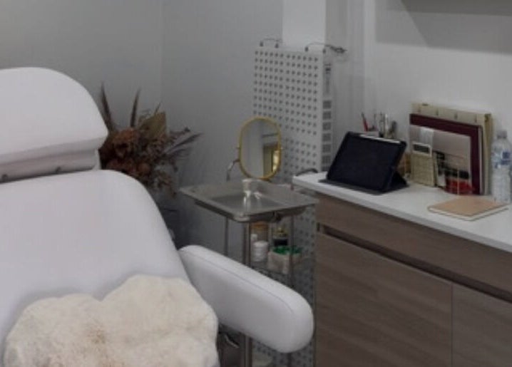 Elegant treatment room at Aesthetix Luxe, Punchbowl, New South Wales, AU, featuring a comfortable white chair.