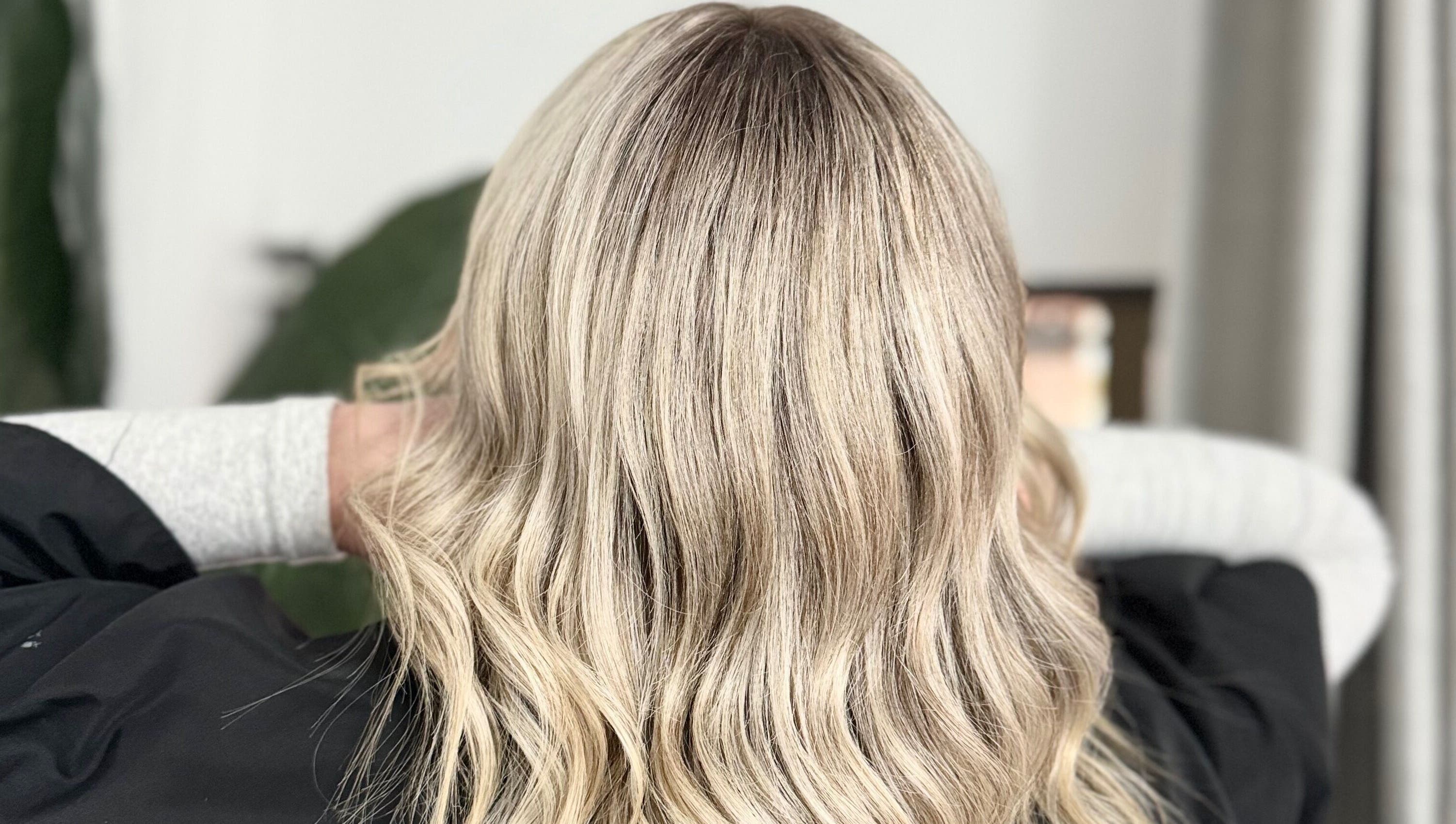 Blonde wavy hairstyle at Solara Hair Studio, Penrith, New South Wales, AU, showcasing expert hair coloring.