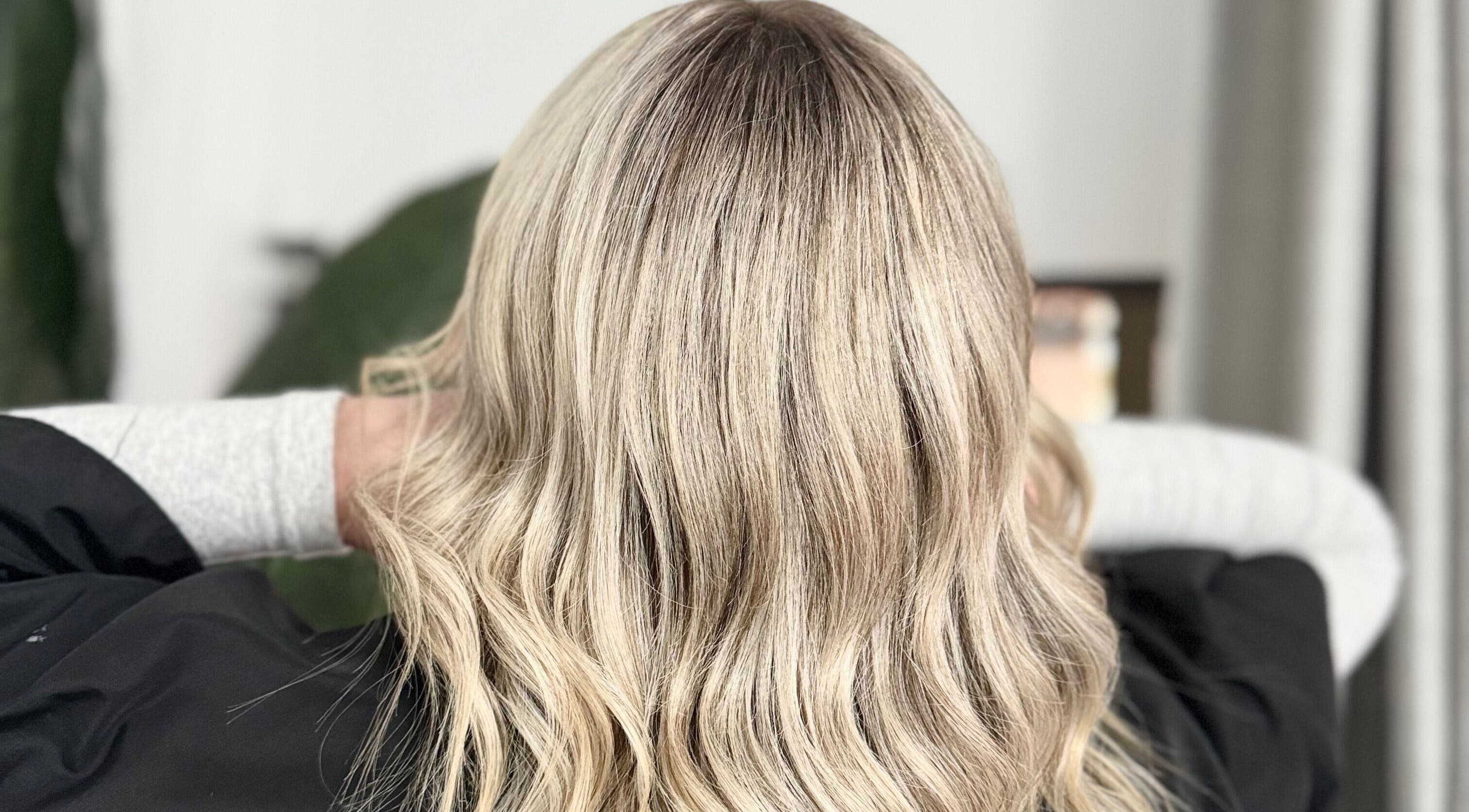 Blonde wavy hairstyle at Solara Hair Studio, Penrith, New South Wales, AU, showcasing expert hair coloring.