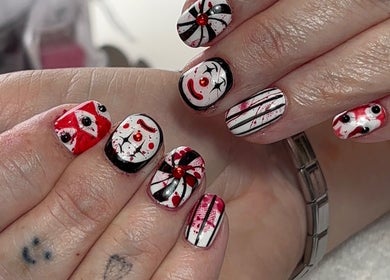 Artistic nail design at Beauty by Meka - Home Salon in Kirkcaldy, Scotland, GB with red and black patterns.