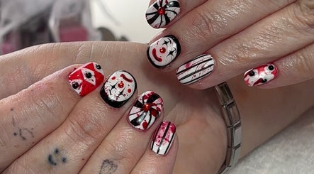 Artistic nail design at Beauty by Meka - Home Salon in Kirkcaldy, Scotland, GB with red and black patterns.