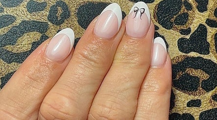 Elegant French manicure with bow detail at Beauty by Meka - Home Salon, Kirkcaldy, Scotland, GB.