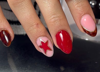 Nail art with red star design at Beauty by Meka - Home Salon, Kirkcaldy, Scotland, GB.