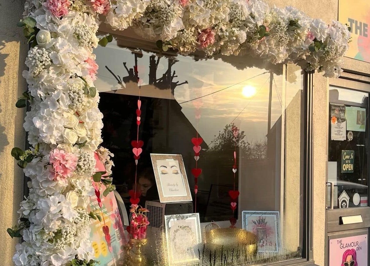 Neat Feet entrance adorned with flowers, Burnham-on-Crouch, England, GB.