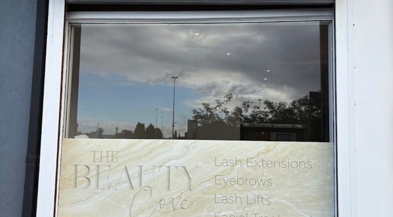 Front window of Secret Beauty Garden in Kidderminster, England, showcasing beauty services like lash extensions.