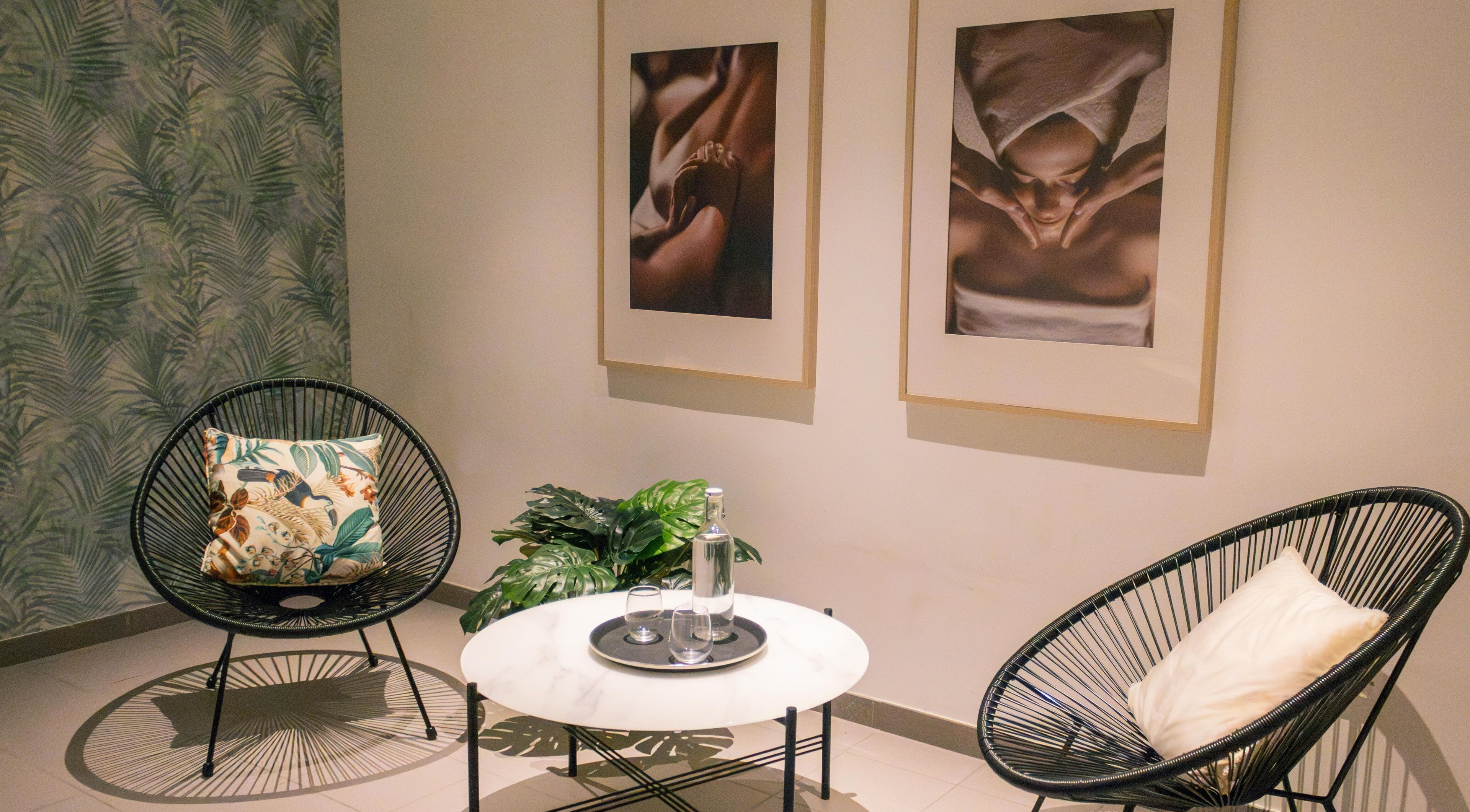 Relaxing lounge at AMIS @ The Embassy Hotel, Valletta, MT, featuring chic decor and cozy seating.