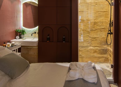 Relaxing therapy room at Amis City Spa, Beauty & Hair Salon in Il-belt Valletta, MT with cozy ambiance.