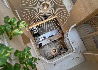 Elegant spiral staircase and greenery at Amis City Spa, Beauty & Hair Salon, Il-belt Valletta, MT.