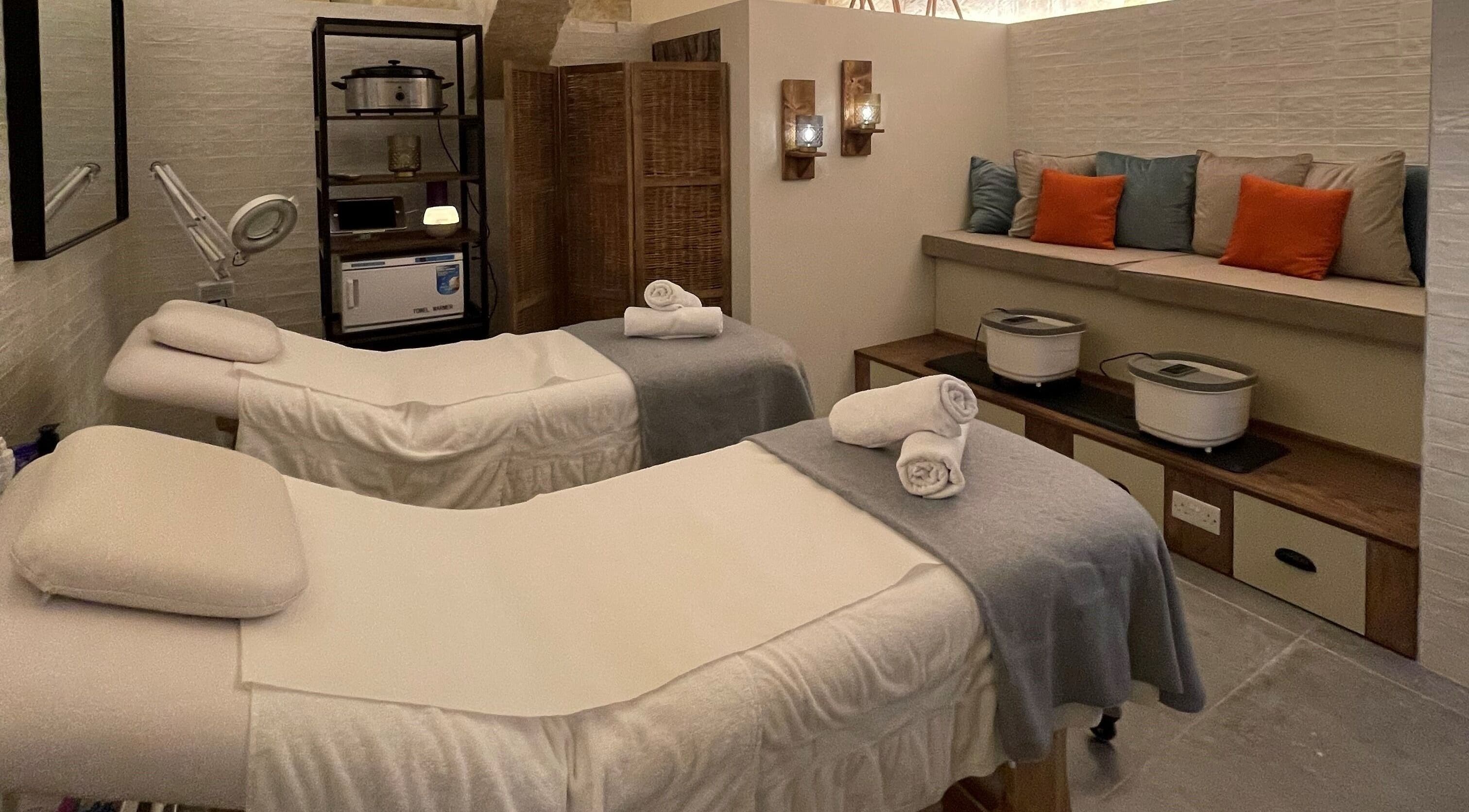 Tranquil treatment room at Amis City Spa, Beauty & Hair Salon, Il-belt Valletta, MT, featuring massage beds.