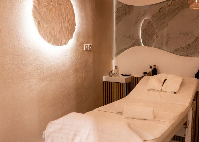 Relaxing massage room at éir Massage Studio, Tas-sliema, MT with a cozy bed and calming decor.