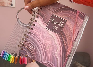 Nail color palette and stylish journal at Radiant Nails, Llanelli, Cymru, GB. Perfect for beauty inspiration.