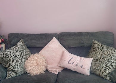Inviting sofa with plush pillows in Radiant Nails, Llanelli, Cymru, GB. Perfect relaxation spot.
