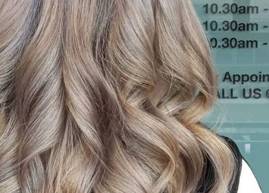 Elegant wavy hairstyle at Dee Hair Studio in Johor Bahru, Johor, MY, showcasing silky sunkissed curls.