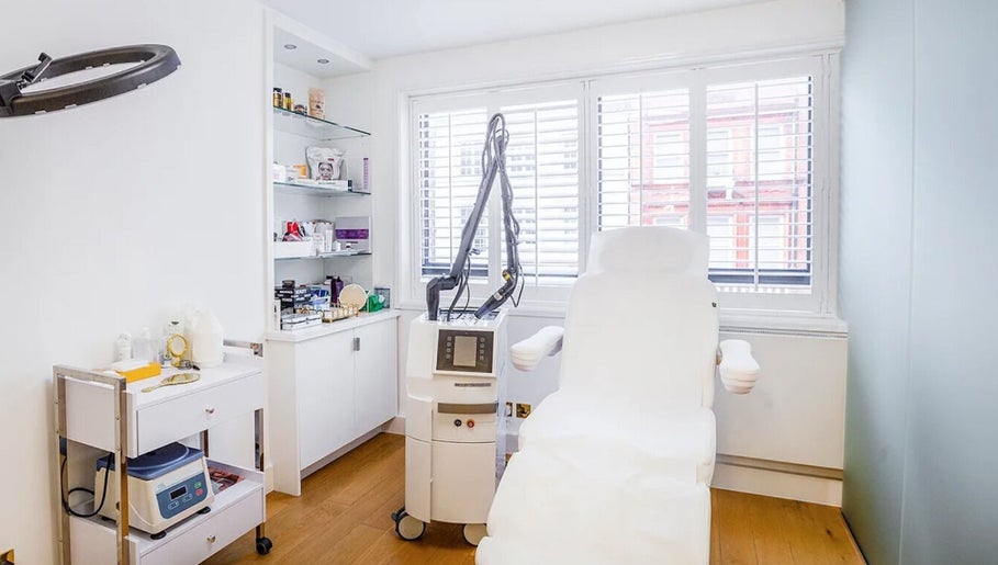 Modern treatment room at HuDerma Clinic, London, England, GB, featuring advanced skincare equipment.