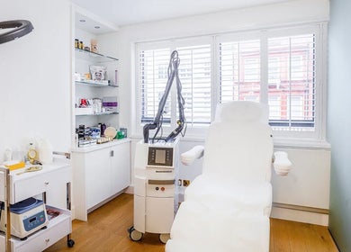 Modern treatment room at HuDerma Clinic, London, England, GB, featuring advanced skincare equipment.