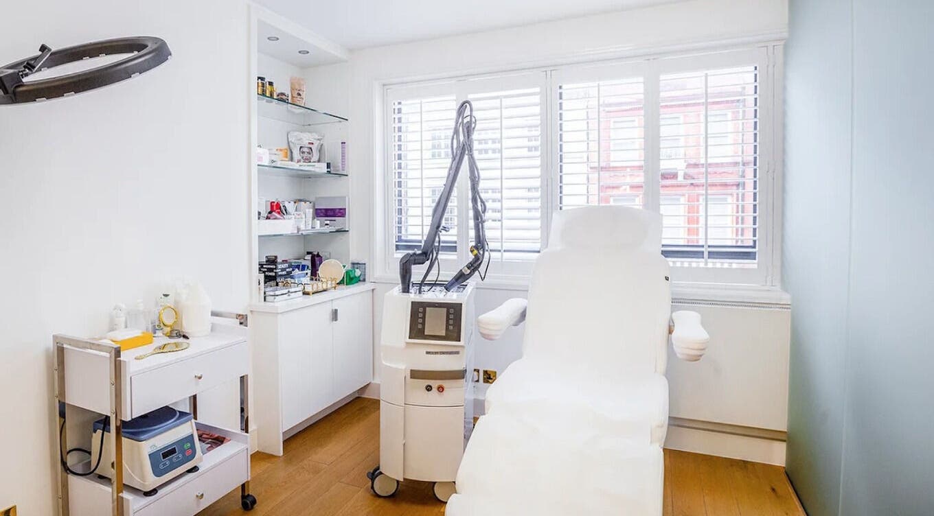 Modern treatment room at HuDerma Clinic, London, England, GB, featuring advanced skincare equipment.