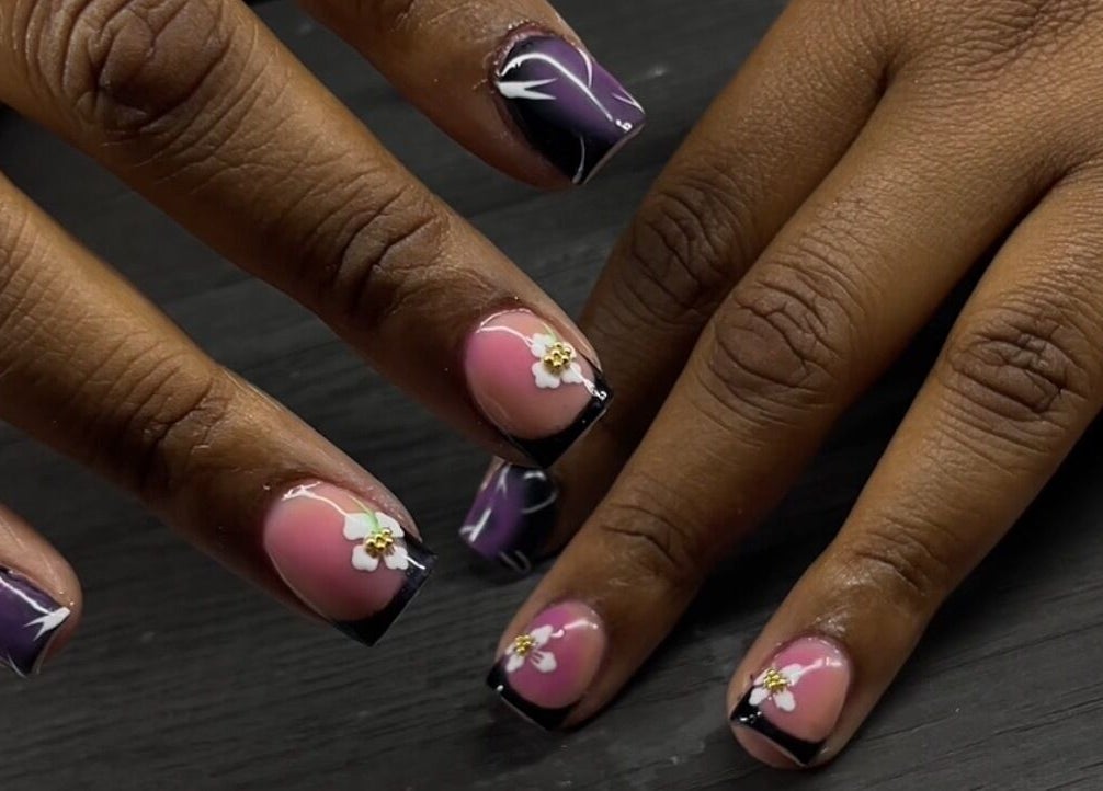 Intricate floral nail art at Reaper Nails in Marietta, Georgia, US, showcasing detailed craftsmanship.