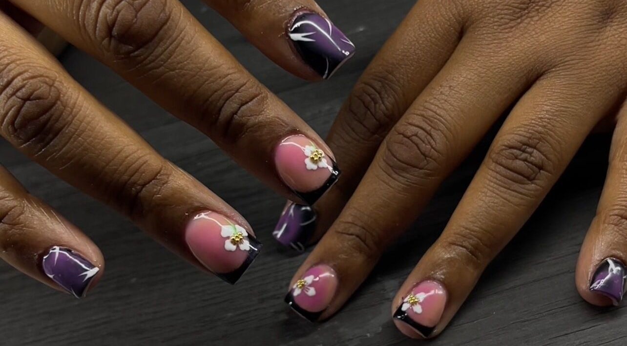 Intricate floral nail art at Reaper Nails in Marietta, Georgia, US, showcasing detailed craftsmanship.
