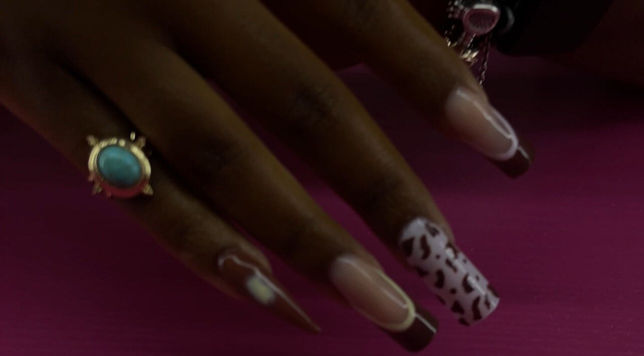 Elegant nail art design at Reaper Nails in Marietta, Georgia, US showcasing intricate patterns and polish.