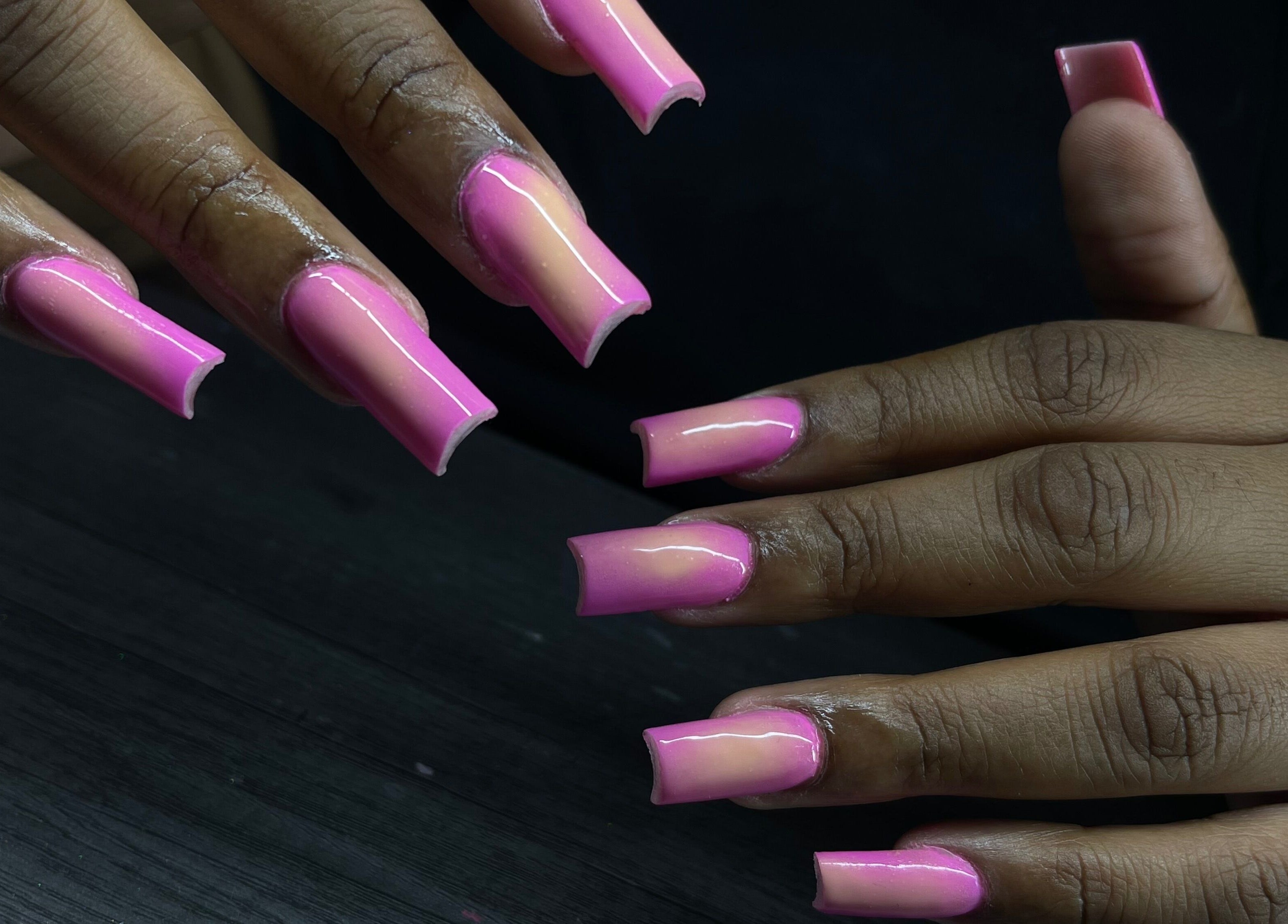 Polished pink nails at Reaper Nails, Marietta, Georgia, US, showcasing expert manicure skills.