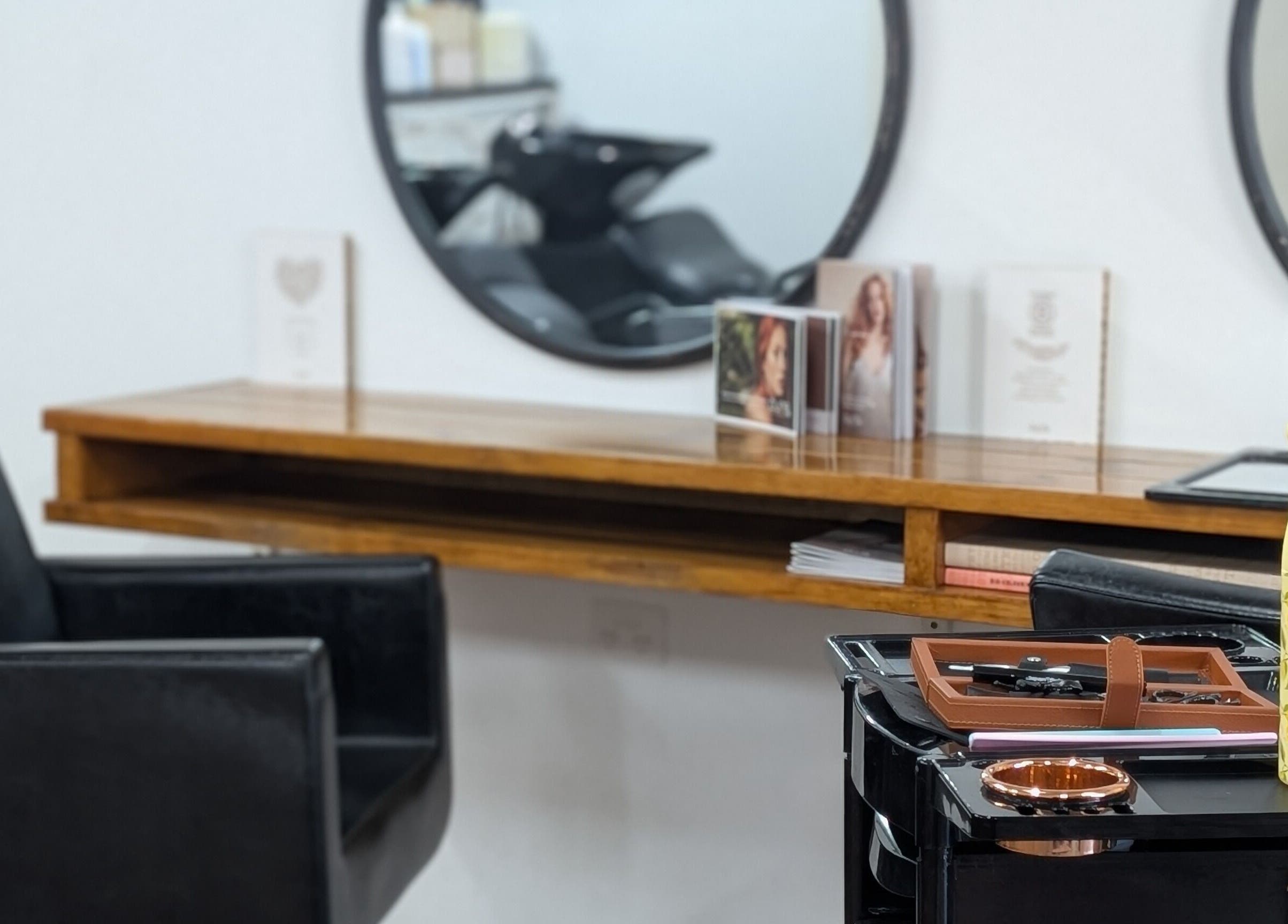 Modern salon chair and mirrors at Blend Atelier, Inverell, New South Wales, AU. Stylish and welcoming interior.