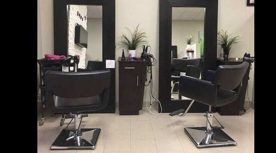 Modern salon chairs and mirrors at Shade hair design salon in Brampton, Ontario, CA, showcasing stylish decor.