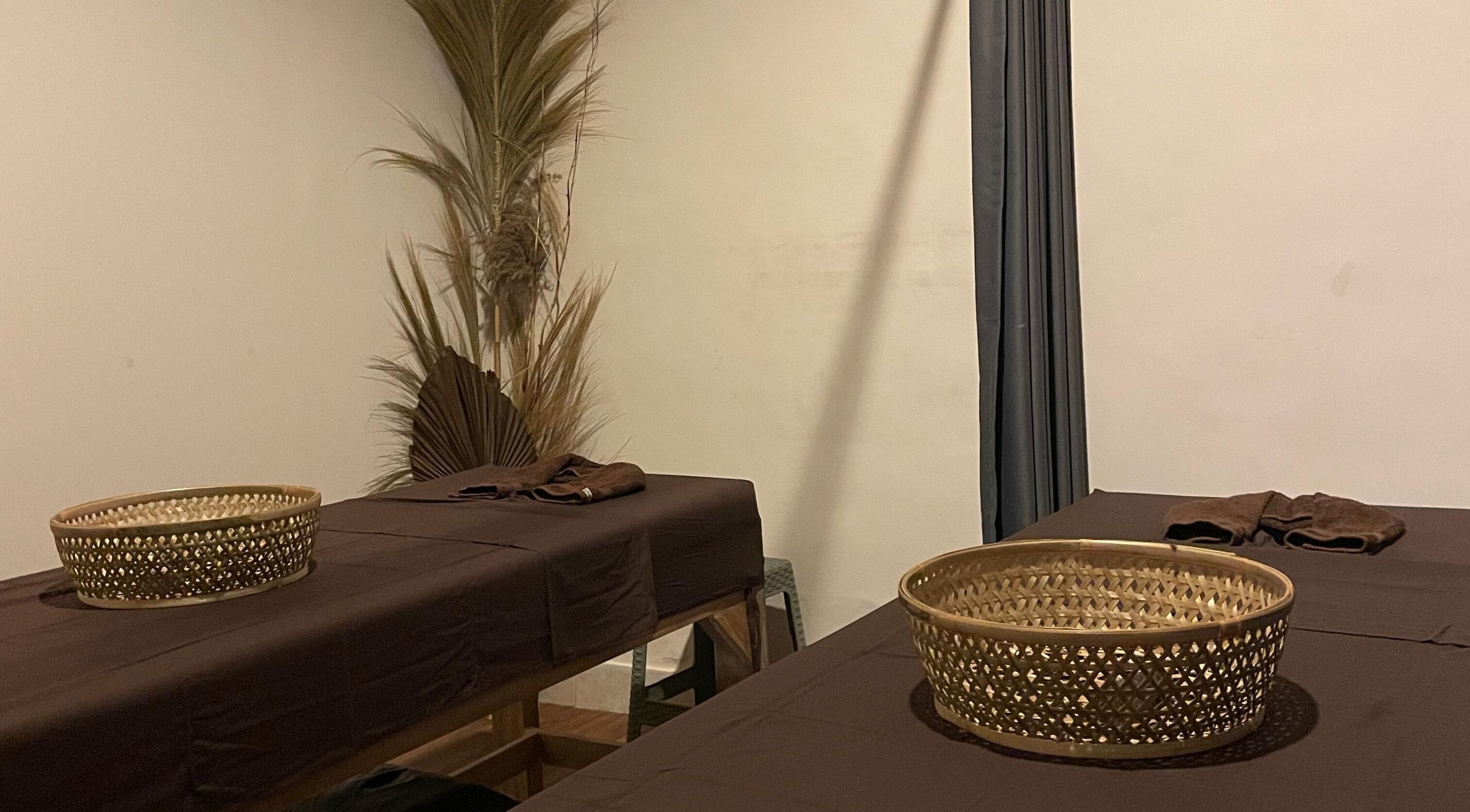 Relaxing treatment room at Khonó Spa, Bali, Bali, ID, featuring massage tables and calming decor.