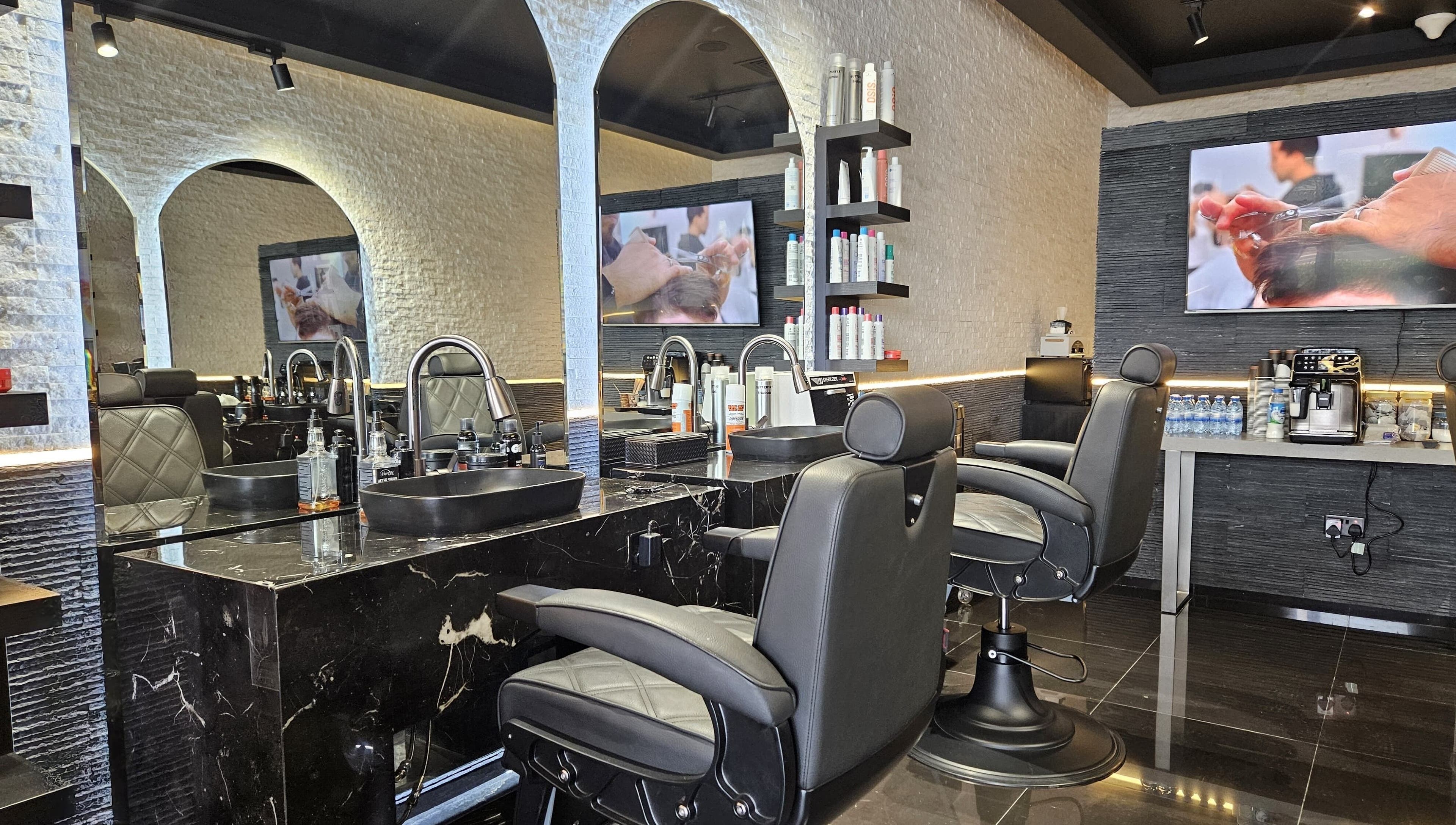 Elegant interior of Cuts Gents Salon in Dubai, Dubai, AE with modern styling chairs and mirrors.