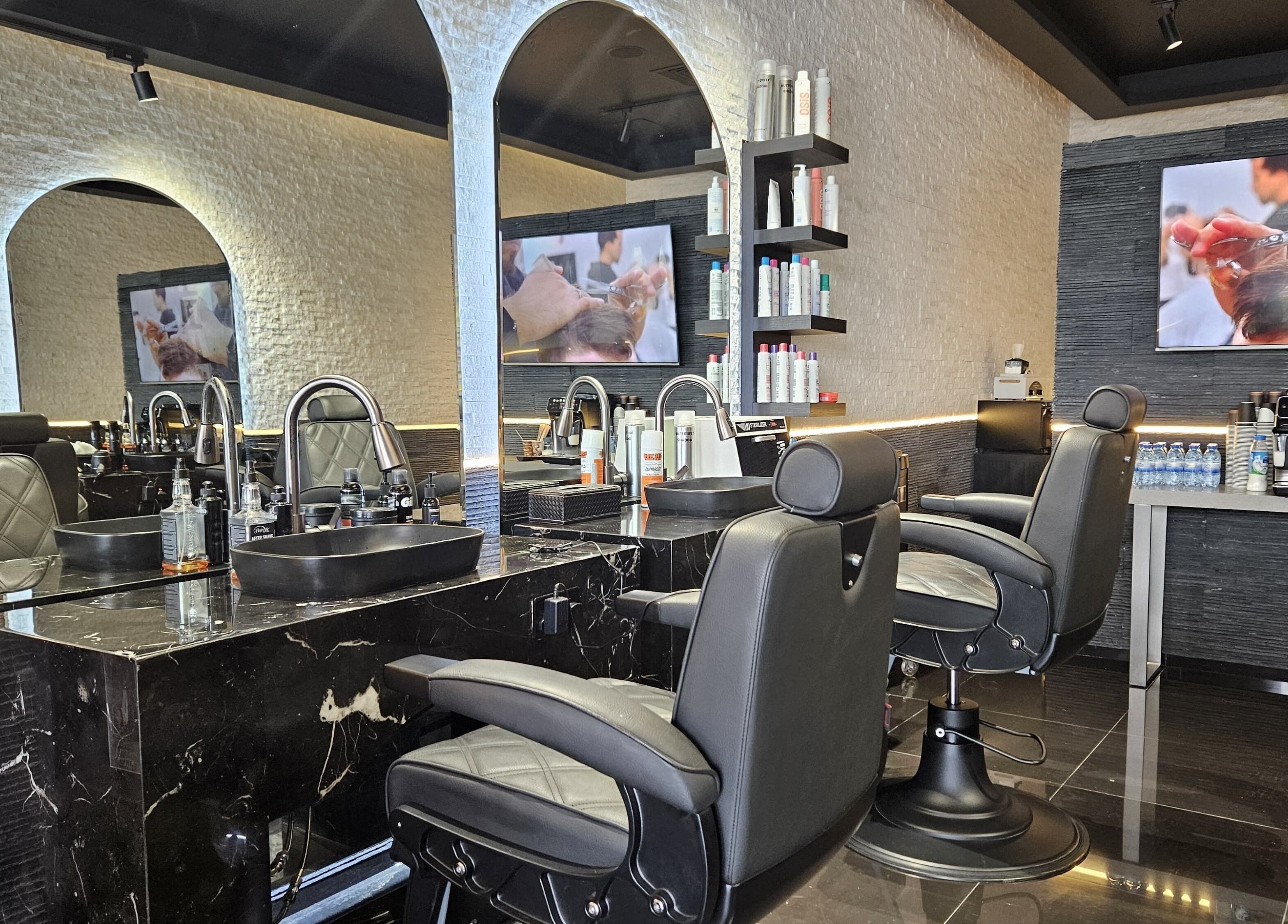 Elegant interior of Cuts Gents Salon in Dubai, Dubai, AE with modern styling chairs and mirrors.