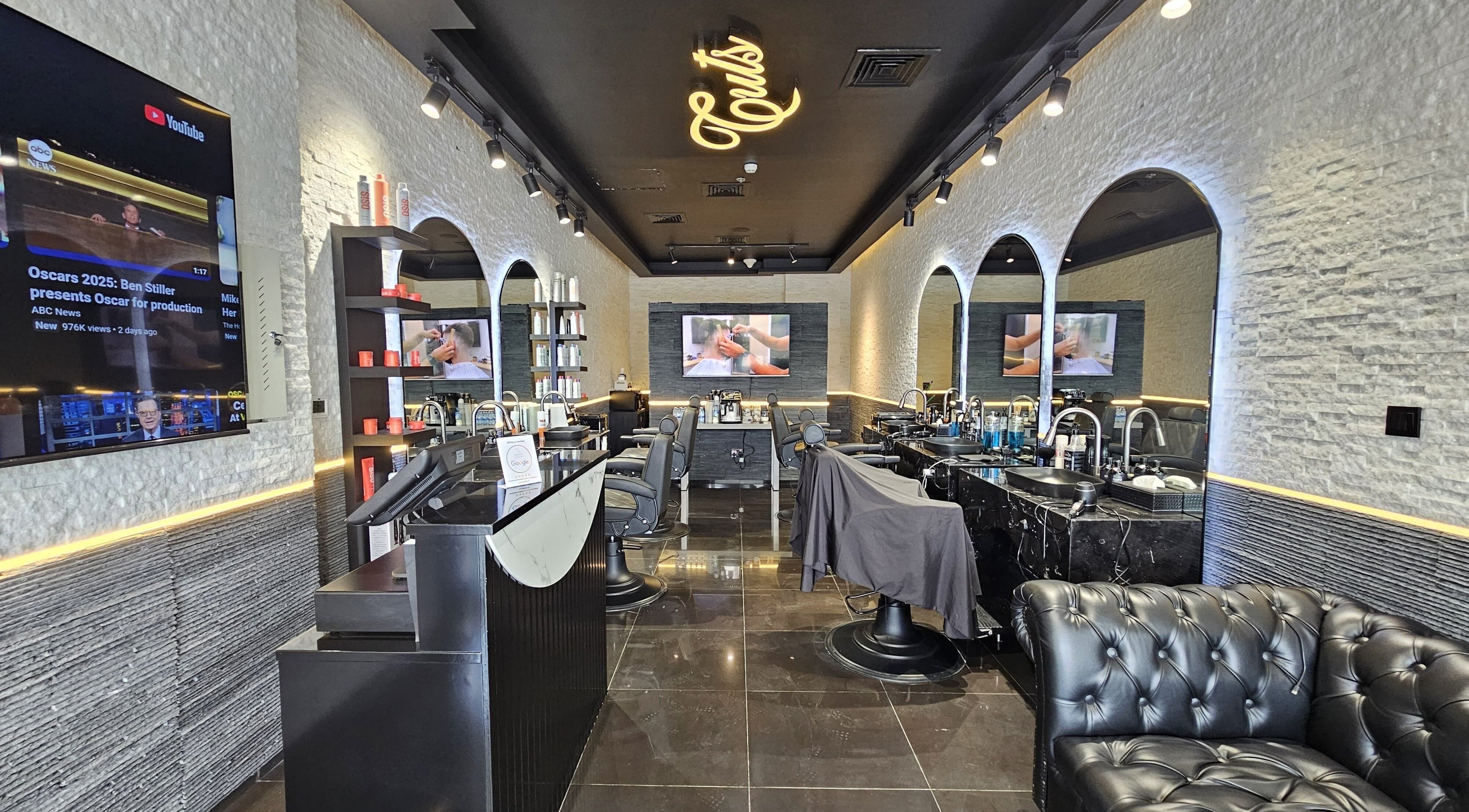 Chic interior of Cuts Gents Salon in Dubai, Dubai, AE with modern decor and comfortable seating.