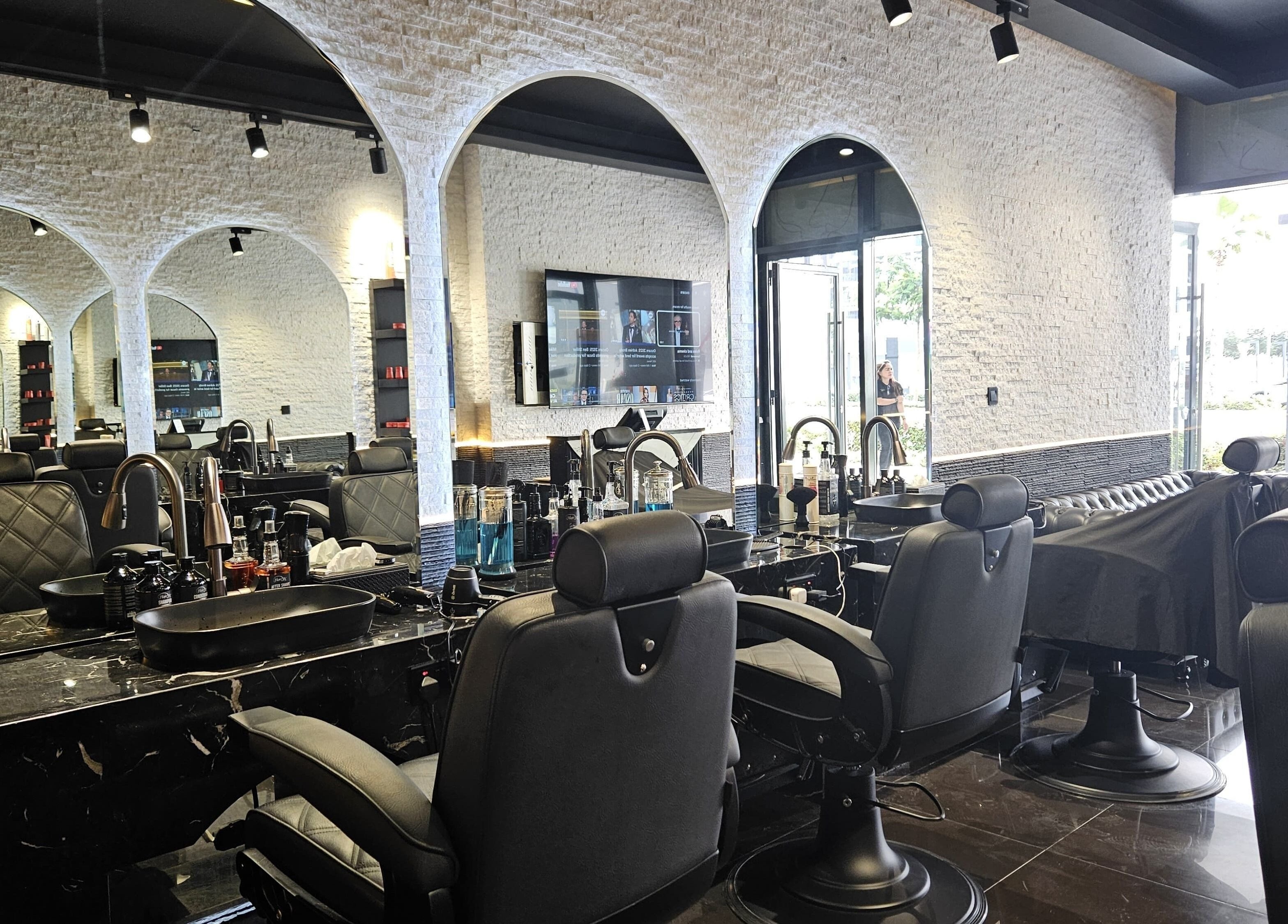 Interior of Cuts Gents Salon in Dubai, Dubai, AE featuring modern chairs and stylish decor.