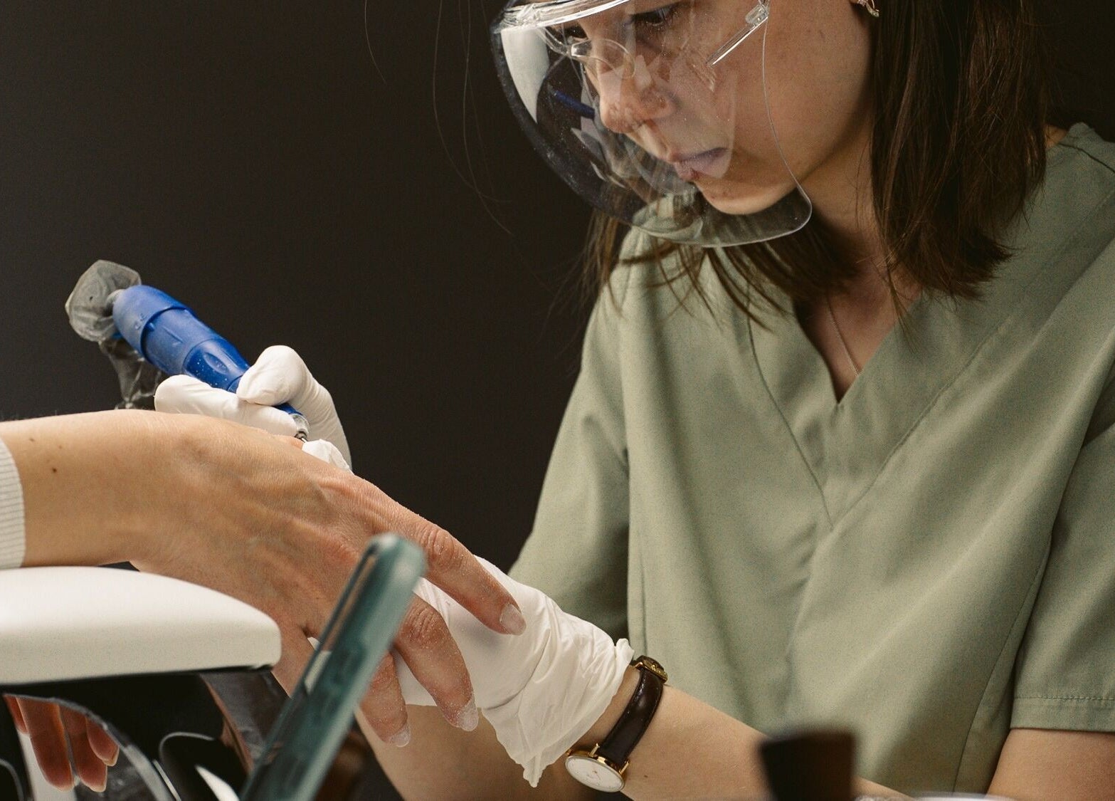 Expert providing manicure at Nails Murr Luxe - Manicure Salon in Canary Wharf, London, England, GB.