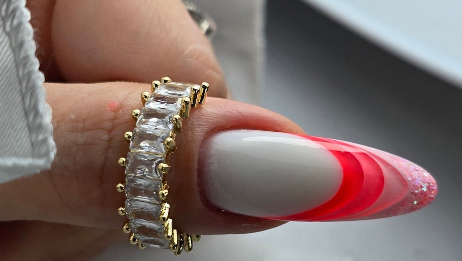 Elegant nail design with red gradient and ring at SWorld Nails, Kingston Upon Hull, Anglia, GB.