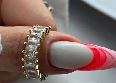 Elegant nail design with red gradient and ring at SWorld Nails, Kingston Upon Hull, Anglia, GB.