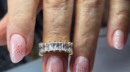 Elegant glitter nail design at SWorld Nails, Kingston Upon Hull, Anglia, GB. Perfect for special occasions.