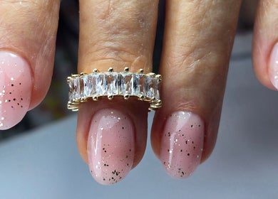 Glittery pink nails with a ring at SWorld Nails, Kingston Upon Hull, Anglia, GB.