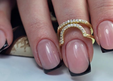 Stylish manicured nails with black tips at SWorld Nails in Kingston Upon Hull, Anglia, GB.